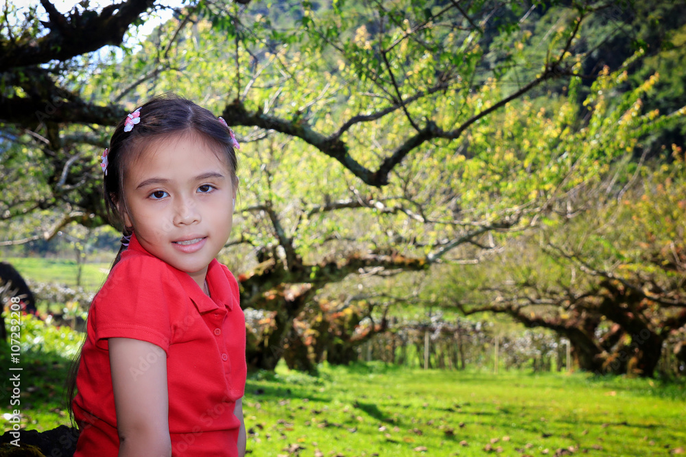 Little girl with green nature background Little girl with green nature background