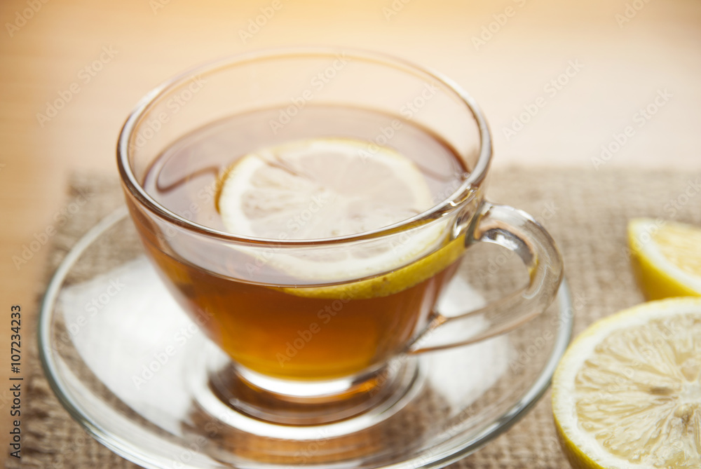 Hot lemon tea on table with soft light morning. Hot lemon tea on table with soft light morning.