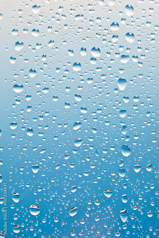 condensation drops on glass with blue backgroung