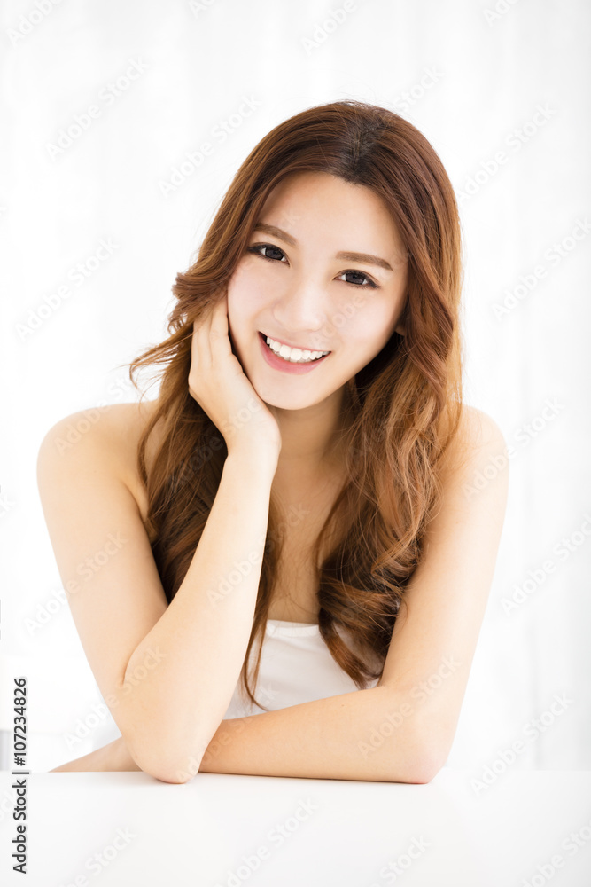 Closeup portrait of attractive young woman smiling Closeup portrait of attractive young woman smiling