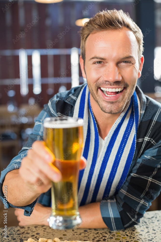 Man toasting a beer