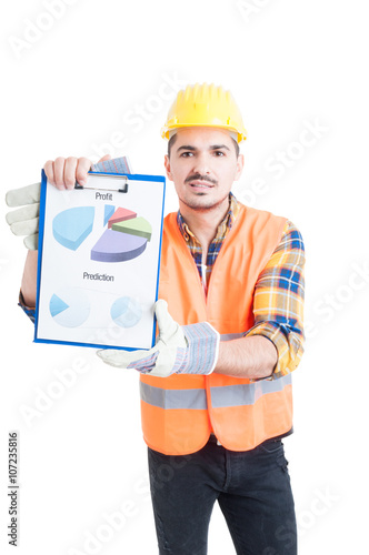 Engineer in workwear and halmet holding a clipboard with charts photo