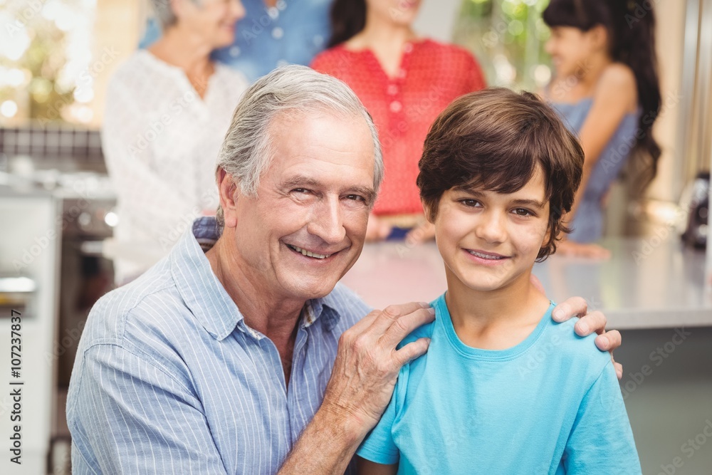 Portrait of grandfather and grandson with family Portrait of grandfather and grandson with family