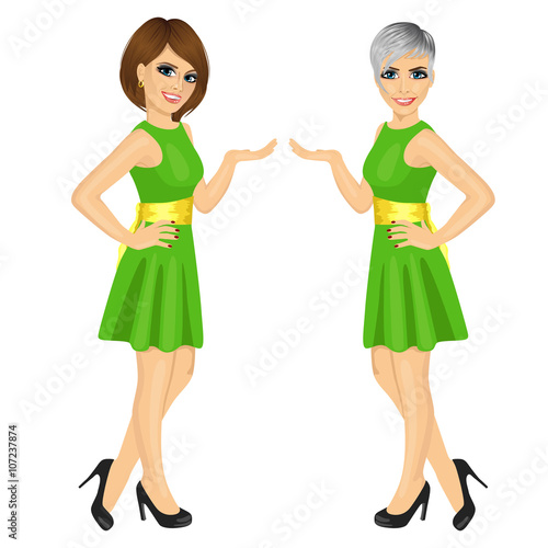 Two beautiful professional fair hostess women showing something