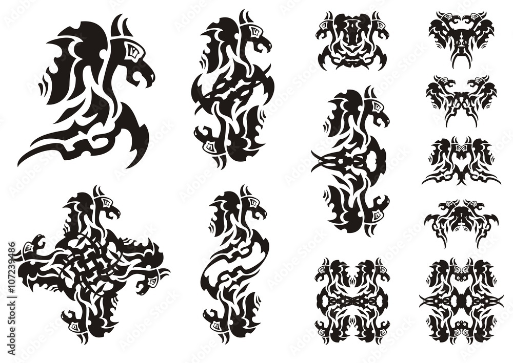 Flaming winged dragon symbols. Double symbols of a dragon, a butterfly of a dragon and dragon patterns isolated on white Flaming winged dragon symbols. Double symbols of a dragon, a butterfly of a dragon and dragon patterns isolated on white