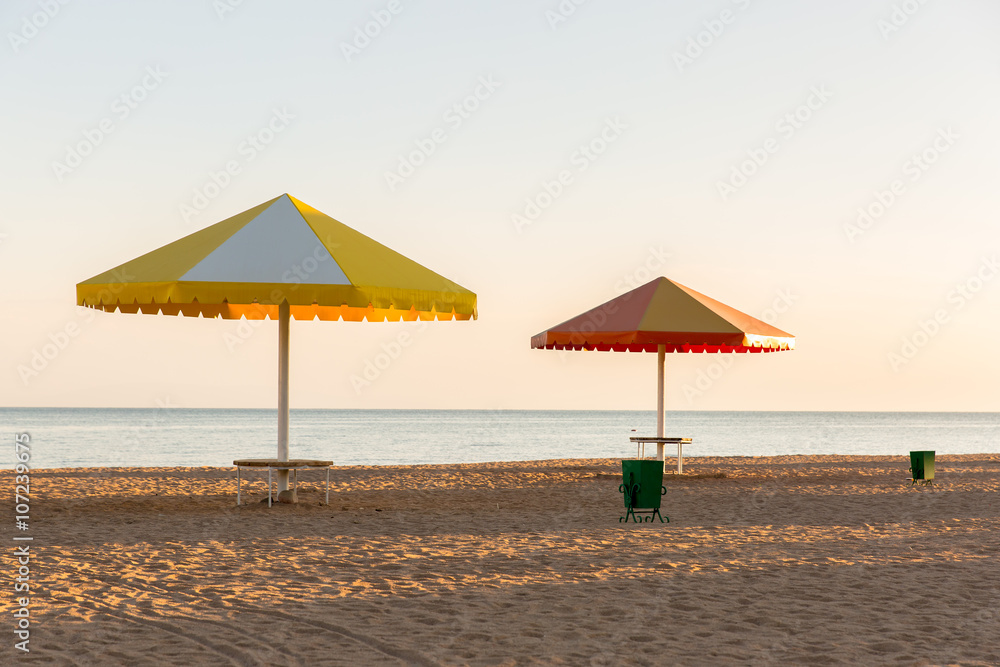 Beach at the sea with the umbrellas.