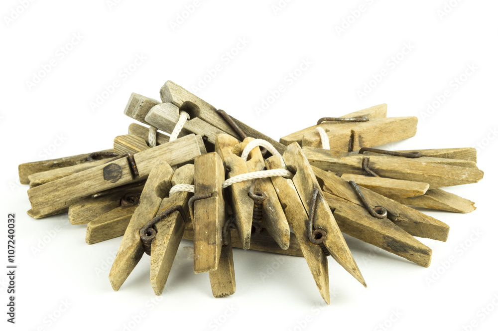 Wooden clothespins on a white background