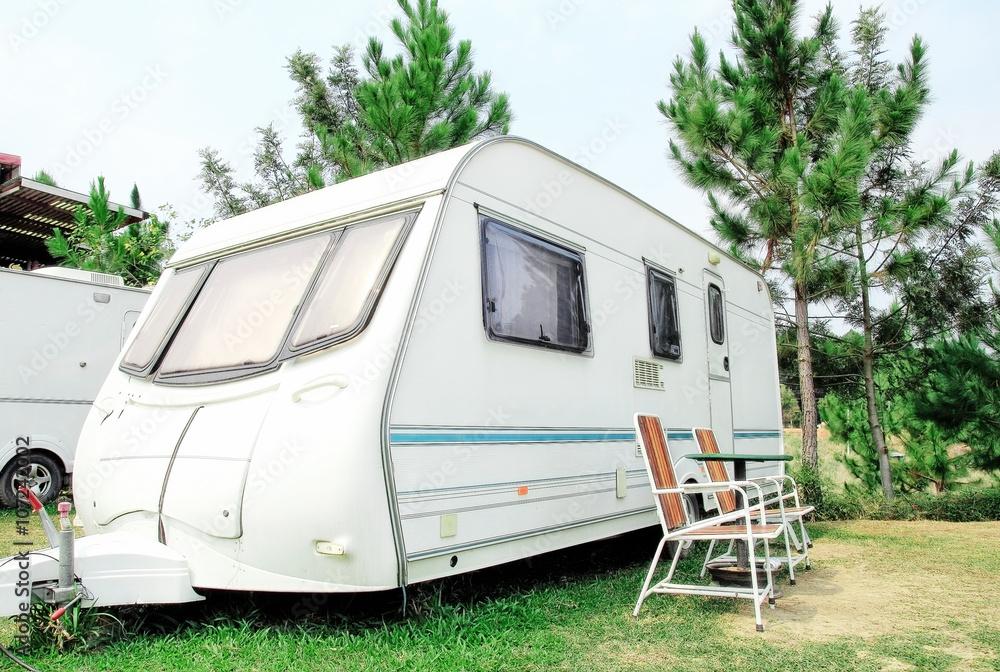 Travel Trailer with chair in the nature Travel Trailer with chair in the nature
