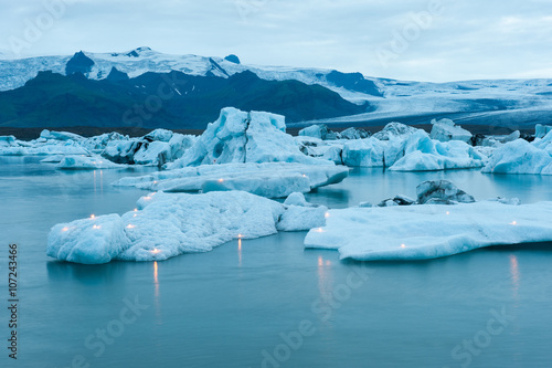 Icebergs with candles, Jokulsarlon ice lagoon before annual firework show, Iceland