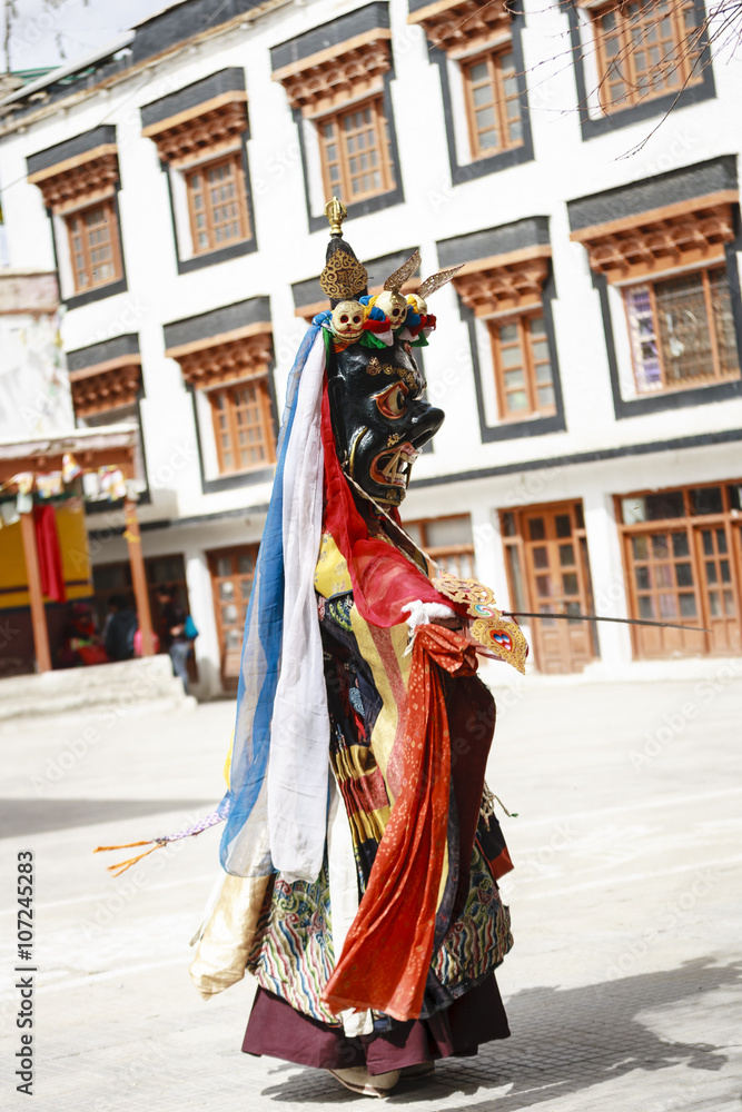 Naklejka premium An unidentified buddhist lamas dressed in mystical mask dancing Tsam mystery dance in time of Yuru Kabgyat Buddhist festival at Lamayuru Gompa, Ladakh, North India