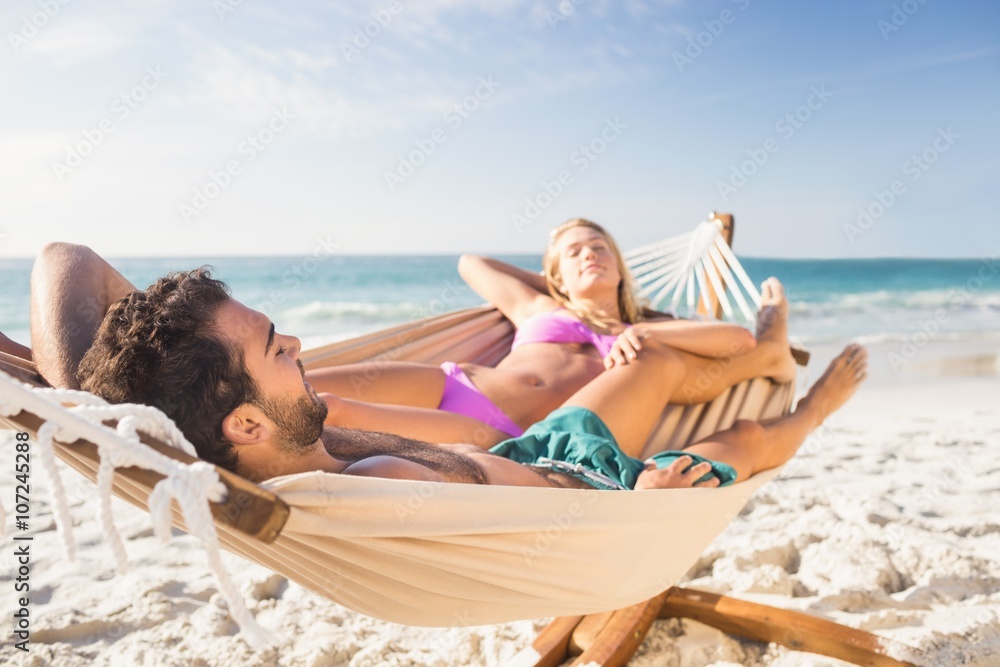 Fototapeta premium Couple lying in hammock