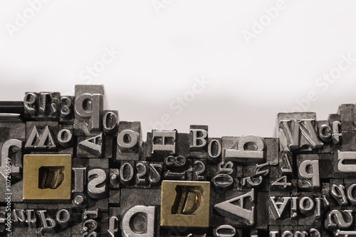 Metal Letterpress Types.
A background from many historic typographical letters in black and white with white background.
