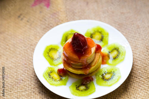 Pancakes with butter and fruit