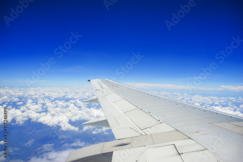 Unic cloud formation with blue sky, view from flight windows wit