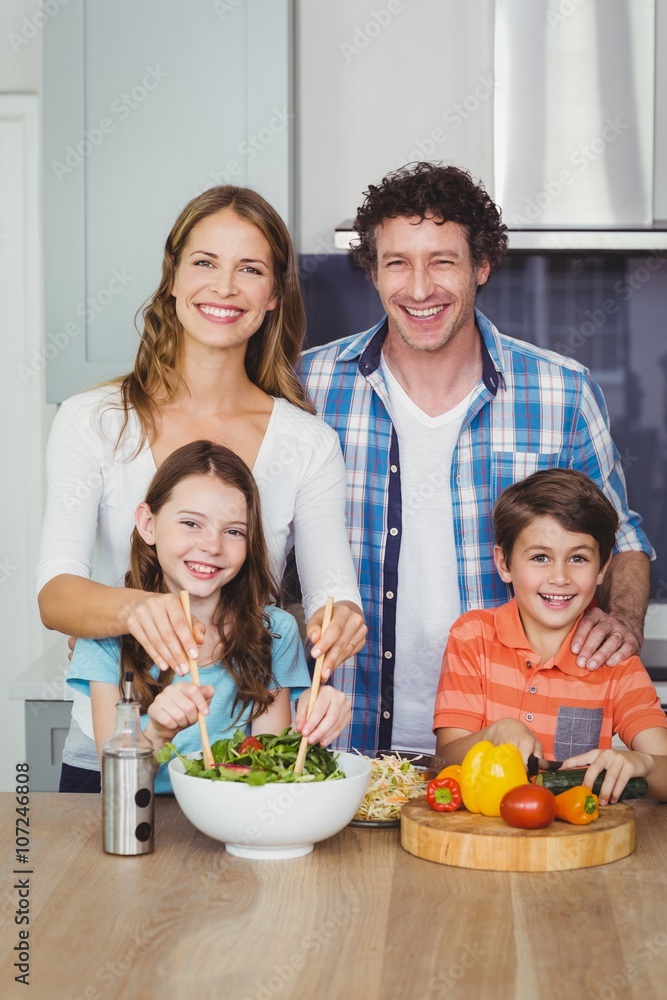 Portrait of happy family in kitchen