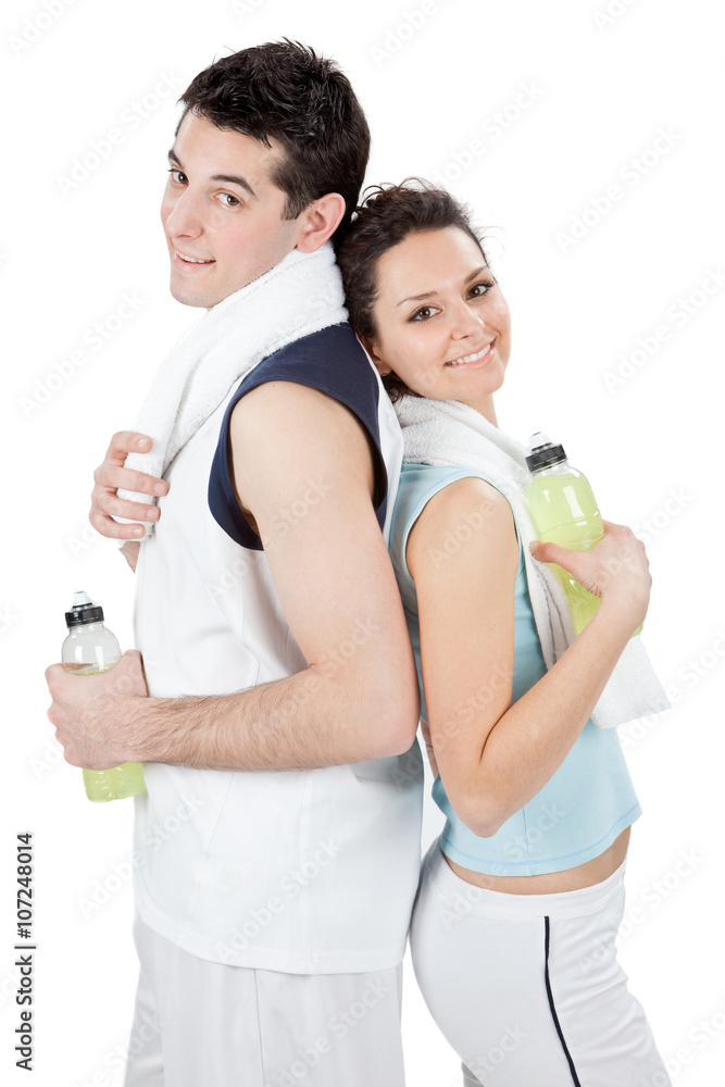 young beautiful couple do fitness together isolated on white young beautiful couple do fitness together isolated on white