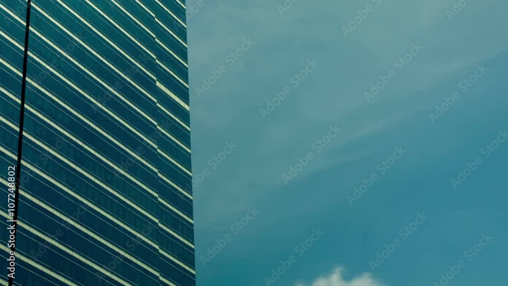 time lapse video of Shining sun and clouds reflected on a corporate glass bulding. Camera moving from Left to right
time lapse video of Shining sun and clouds reflected on a corporate glass bulding. Camera moving from Left to right