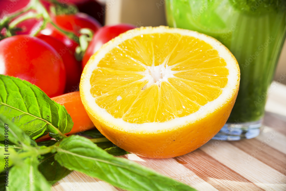 Orange half for smoothie on a wooden board Orange half for smoothie on a wooden board