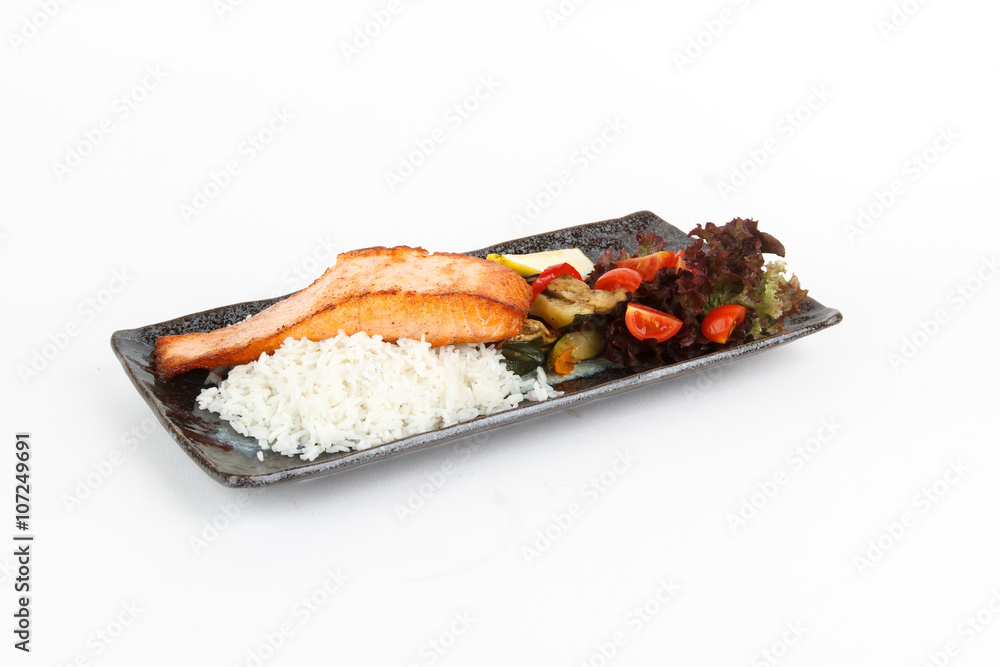 Image of tasty baked salmon with rise and vegetables Image of tasty baked salmon with rise and vegetables