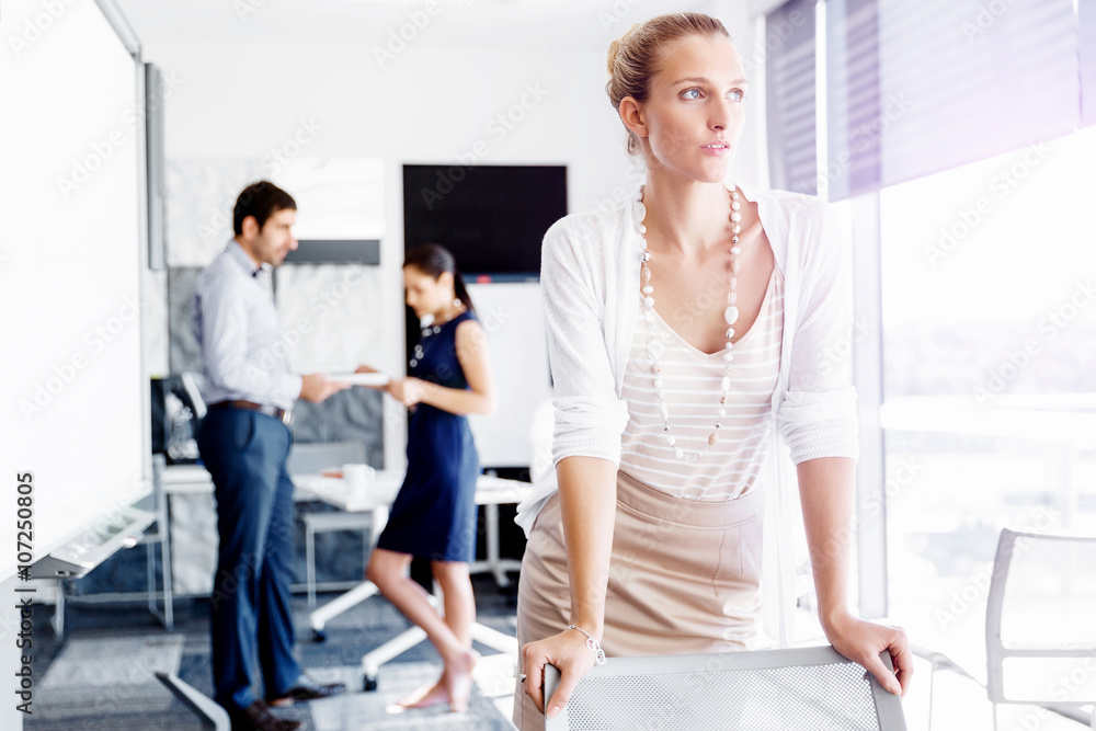 Attractive female worker in office Attractive female worker in office