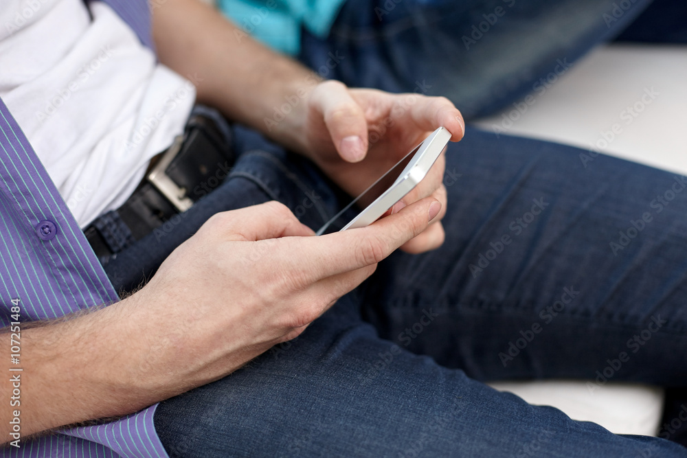 close up of male hands with smartphones texting close up of male hands with smartphones texting
