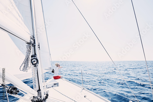 Girl on sailboat © Sergey Furtaev