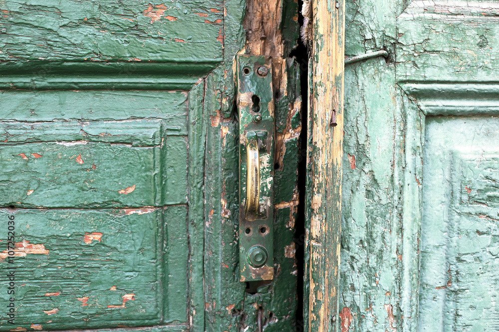 Door handle on an antique wooden door Door handle on an antique wooden door