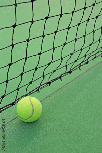 Tennis ball in net © phaitoon
