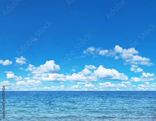 Seascape with calm sea and cloudy sky.