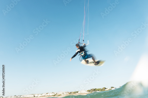Fototapeta Naklejka Na Ścianę i Meble -  Surfer flying through the sky