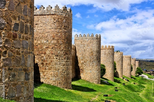 Mighty medieval wall and towers surrounding the old town of Avila, Spain