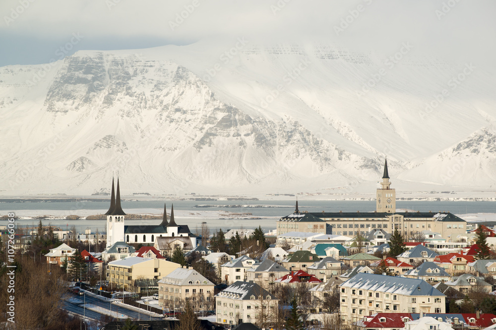 Aerial view of Reykjavik from Perlan, snow capped mountains in winter, Iceland