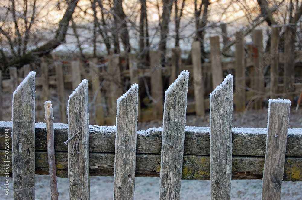 Old wooden fence, covered with frost. Close up.. Old wooden fence, covered with frost. Close up..