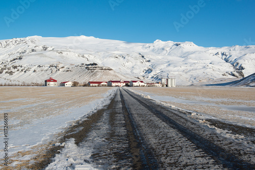 Icelandic farm under the Eyjafjallajokull volcano, winter landscape, Iceland photo