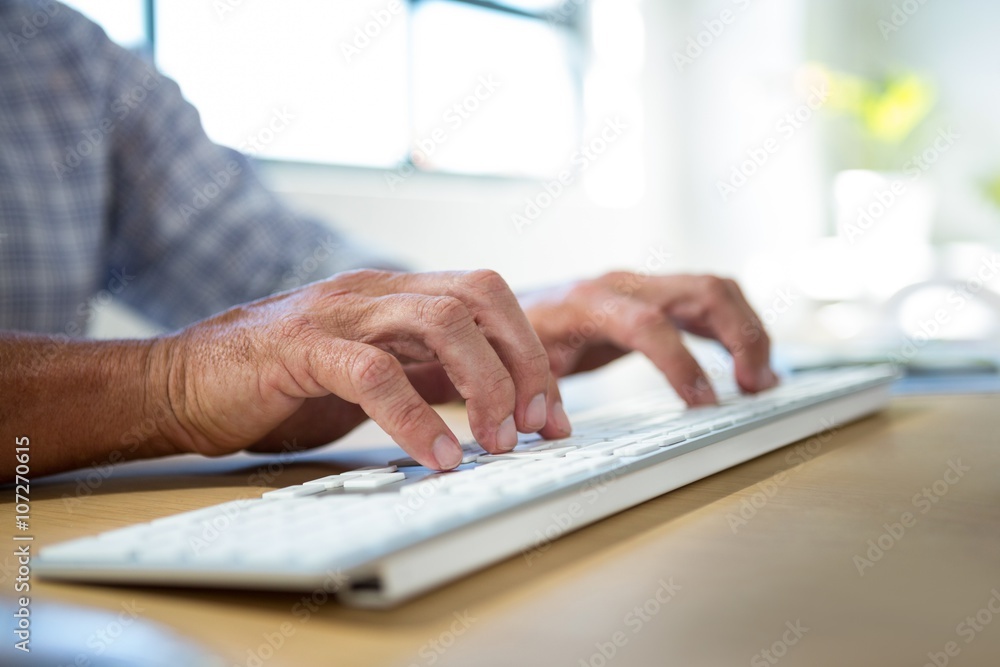 Man typing on keyboard Man typing on keyboard