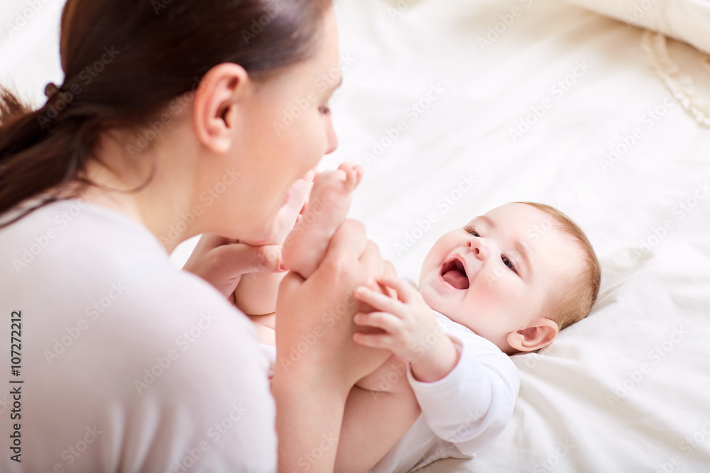 Mother and baby playing and laughing. A happy family Mother and baby playing and laughing. A happy family