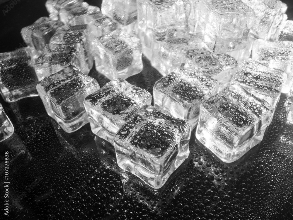fake ice cubes sprayed with water black and white abstract concept