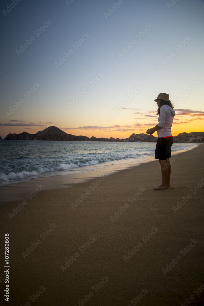Woman Enjoys time on the beach in Mexico