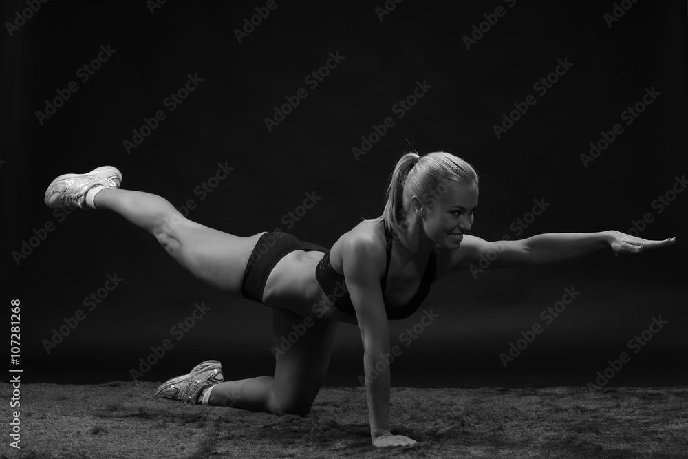 Young beautiful sporty woman Fit sportswoman stretching