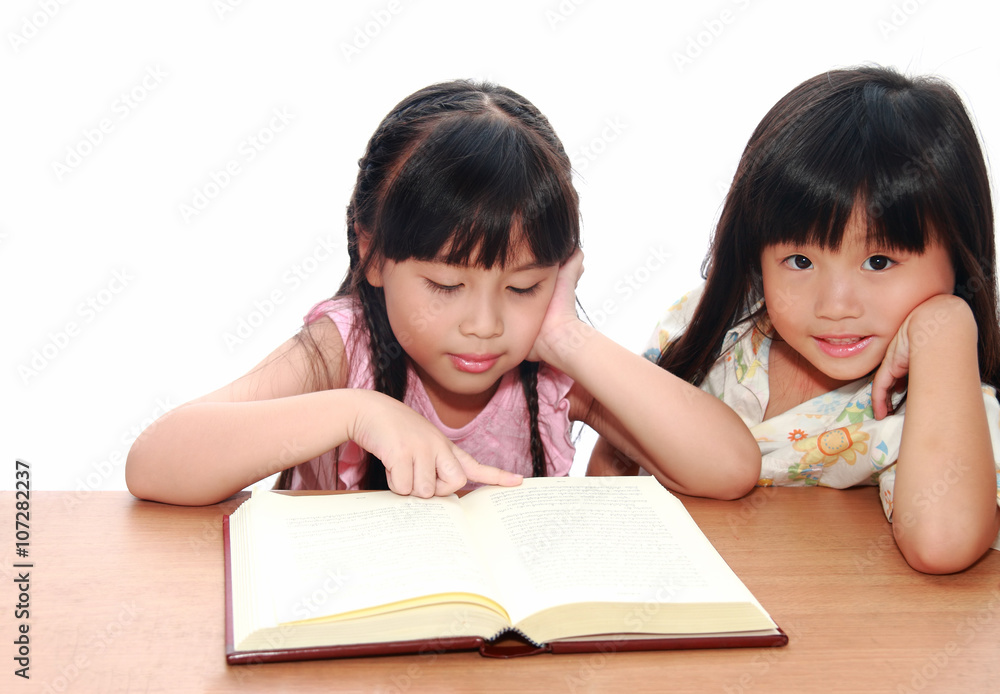 Intelligent little girl reading a book Intelligent little girl reading a book