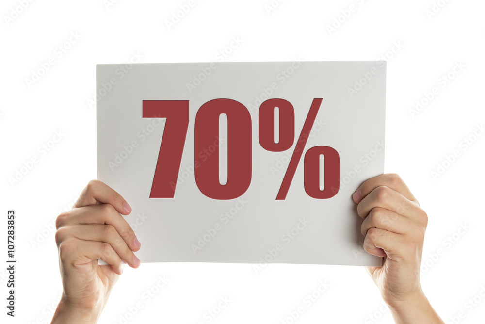 Hand holding a banner with the words 70 percent Hand holding a banner with the words 70 percent