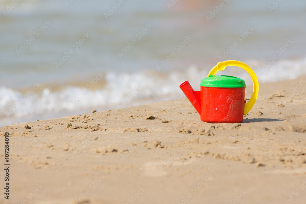 Children head left on the shore of the beach near the water Children head left on the shore of the beach near the water