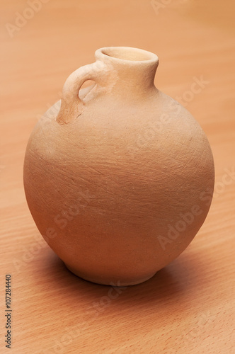 Pitcher, vintage, ethnic, clay ,table, beige, with a narrow neck
