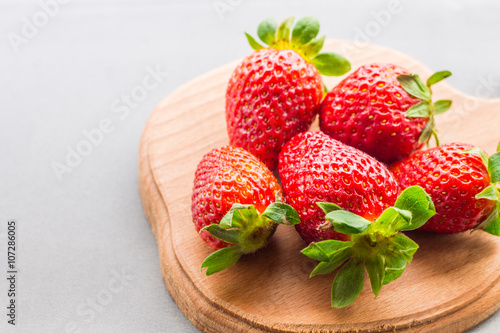 strawberries on a wooden board