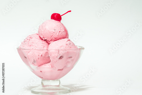 fruit icecream and candied sweet cherries and cherry,isolates,in a cup of ice cream