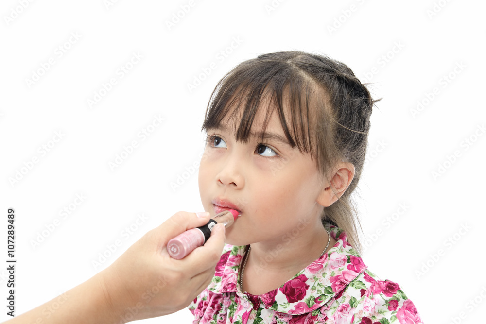 Sweet little asian girl painting makeup lipstick Sweet little asian girl painting makeup lipstick