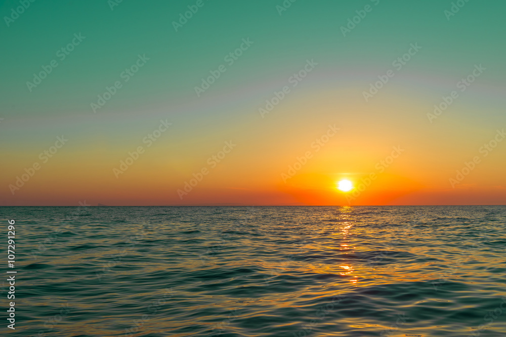 Sunset in Santorini. Amazing colours when the sun sets in the se Sunset in Santorini. Amazing colours when the sun sets in the se