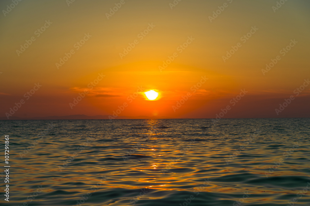 Sunset in Santorini. Amazing colours when the sun sets in the se Sunset in Santorini. Amazing colours when the sun sets in the se