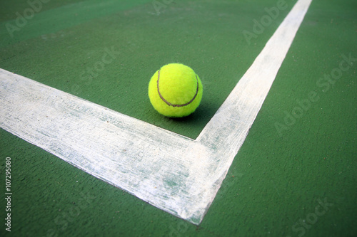 Tennis ball on a tennis court © phaitoon