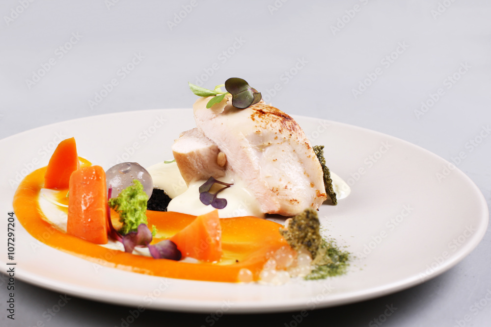 chicken breast with vegetables on a white plate. chicken breast with vegetables on a white plate.